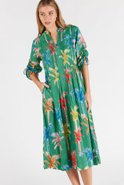 A model wearing the Leilani Cotton Midi Dress in colour Sea (Green), from the front, cropped image
