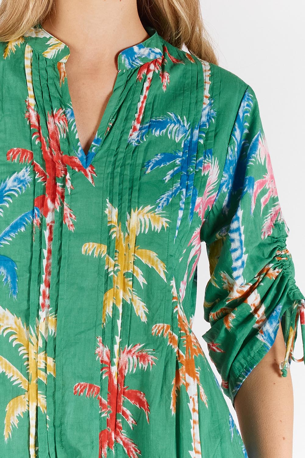 A model wearing the Leilani Cotton Midi Dress in colour Sea (Green), from the front, cropped image