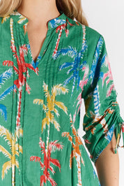 A model wearing the Leilani Cotton Midi Dress in colour Sea (Green), from the front, cropped image