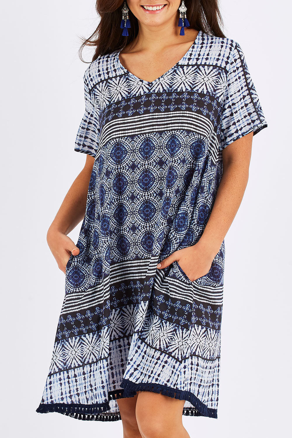 Model Chesska wearing size S of the Lotus Dress in colour Navy (Blue), from the front, cropped image