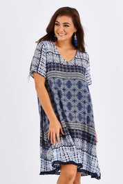 Model Chesska wearing size S of the Lotus Dress in colour Navy (Blue), from the front, showing the whole outfit