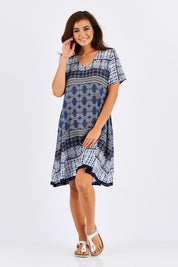 Model Chesska wearing size S of the Lotus Dress in colour Navy (Blue), from the front, showing the whole outfit
