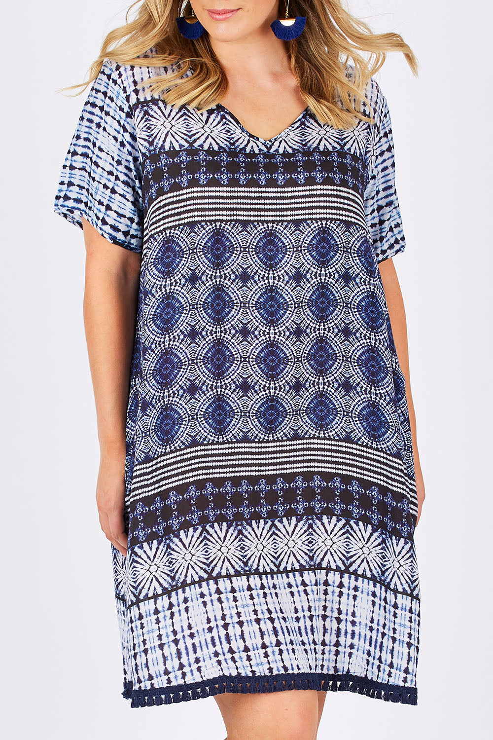 Model Jess wearing size L of the Lotus Dress in colour Navy (Blue), from the front, cropped image
