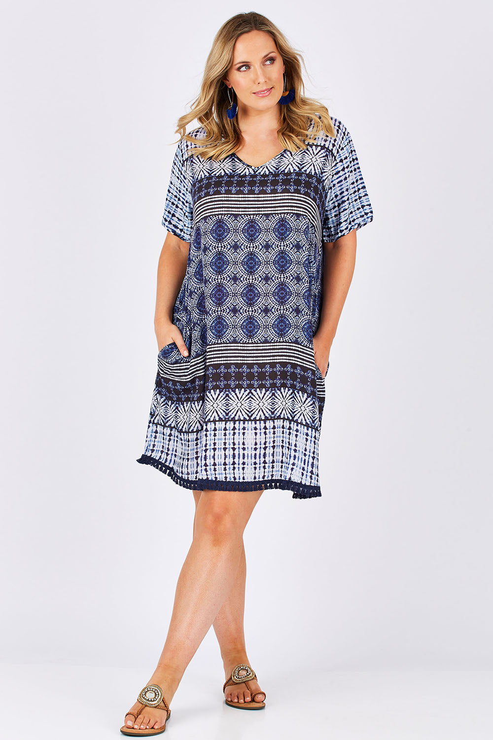 Model Jess wearing size L of the Lotus Dress in colour Navy (Blue), from the front, showing the whole outfit