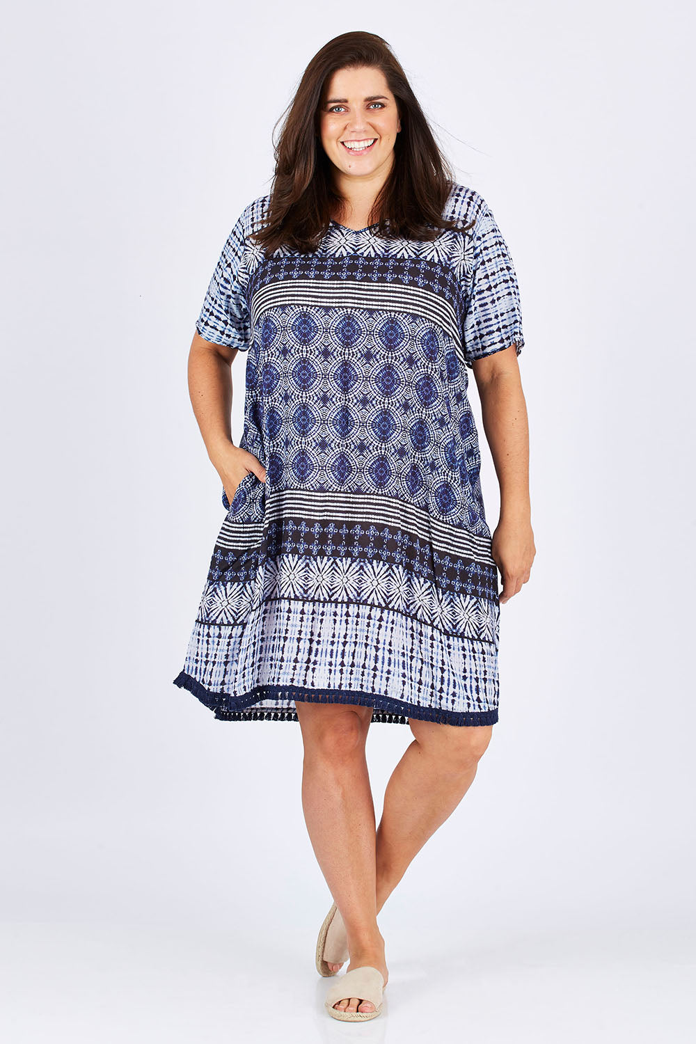 Model Mae wearing size XXL of the Lotus Dress in colour Navy (Blue), from the front, showing the whole outfit