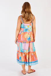 A model wearing the Luna Cotton Sundress in colour Candy, from the back