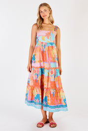 A model wearing the Luna Cotton Sundress in colour Candy, from the front, showing the whole outfit