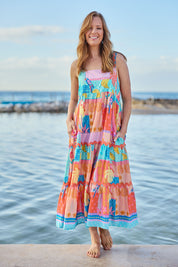 Model Katie wearing size S of the Luna Cotton Sundress in colour Candy, from the front, showing the whole outfit