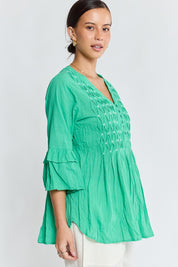 Model Genericm wearing size sample of the Marilyn Shirt – Sea in colour Sea, from an angle