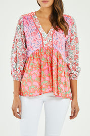 Model Madeline wearing size S of the Maud Top in colour Multi (Pink), from the front, cropped image