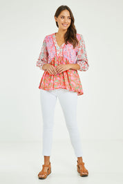 Model Madeline wearing size S of the Maud Top in colour Multi (Pink), from the front, showing the whole outfit