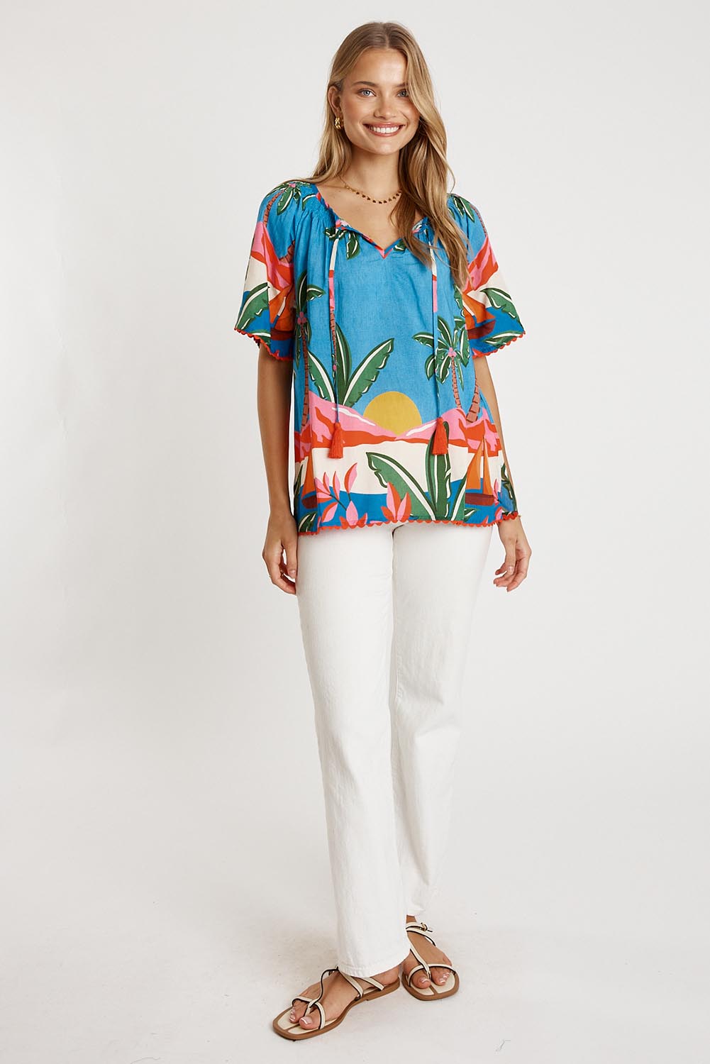 A model wearing the Pacifica Top in colour Print (Blue), from the front, showing the whole outfit