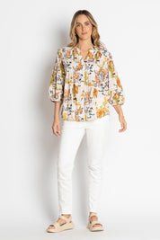 A model wearing the Prairie Cotton Shirt in colour White, from the front, showing the whole outfit