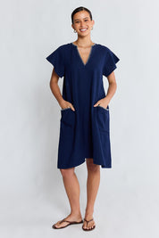 Model Genericm wearing size sample of the Remi Dress – Navy in colour Navy, from the front