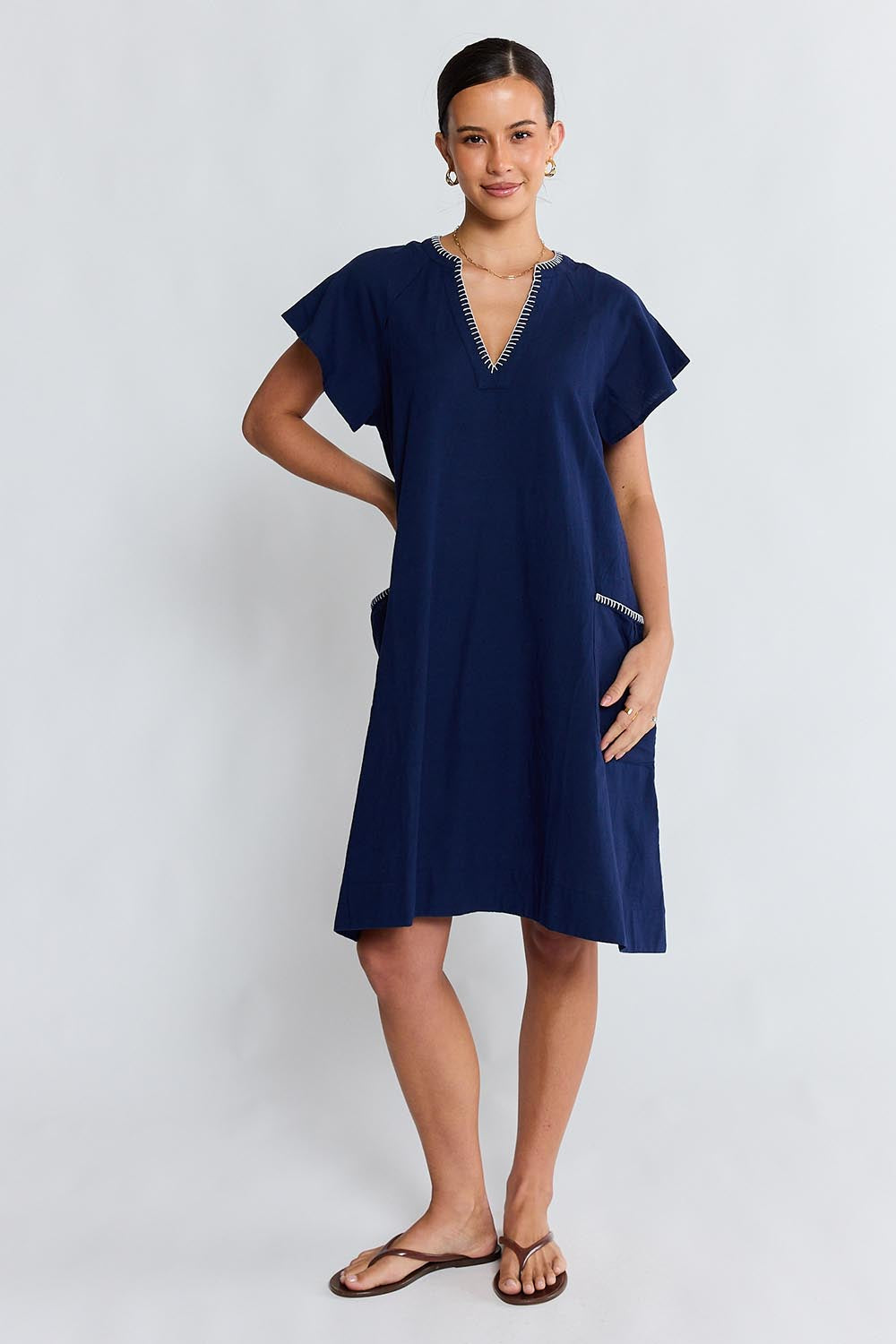 Model Genericm wearing size sample of the Remi Dress – Navy in colour Navy, from the front