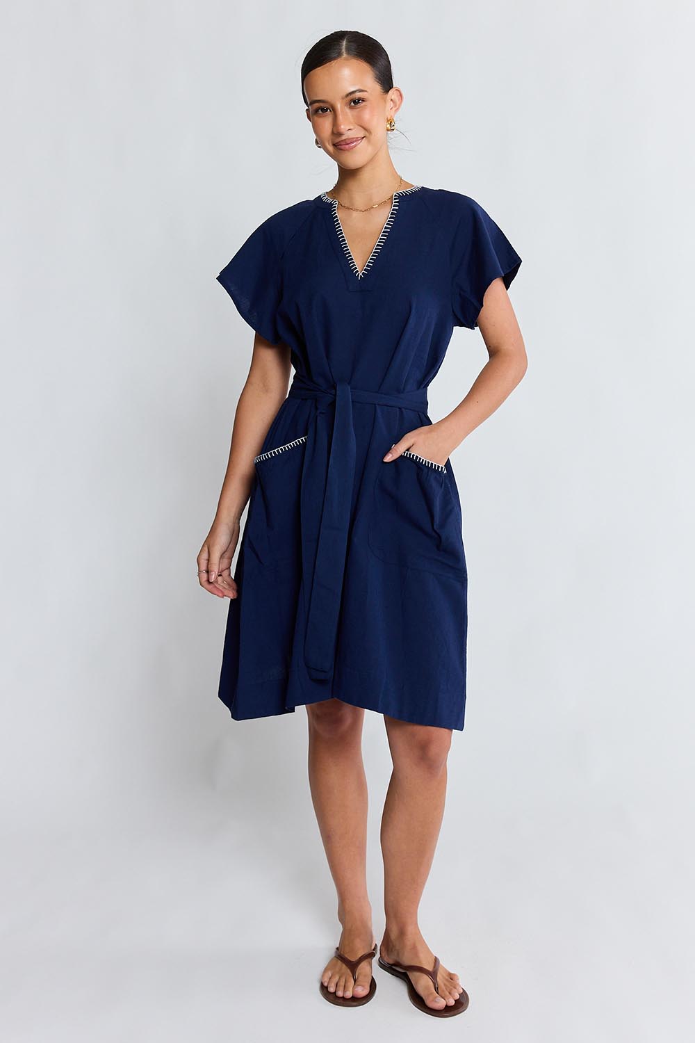 Model Genericm wearing size sample of the Remi Dress – Navy in colour Navy, from the front