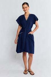 Model Genericm wearing size sample of the Remi Dress – Navy in colour Navy, from the front