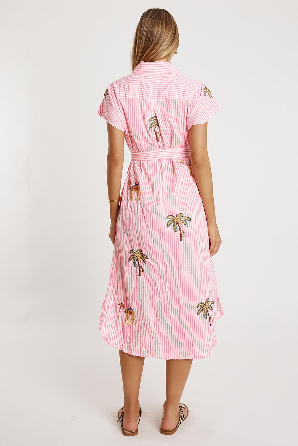 A model wearing the Sahara Cotton Shirtmaker Dress in colour Candy (Pink), from the back