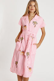 A model wearing the Sahara Cotton Shirtmaker Dress in colour Candy (Pink), from the front, cropped image
