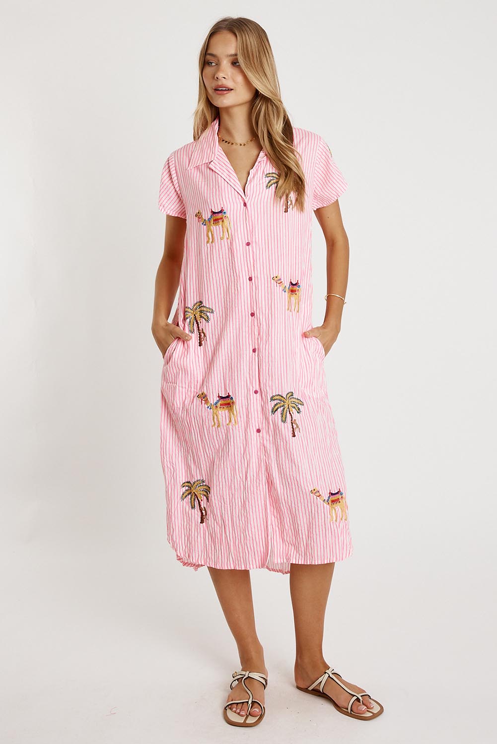 A model wearing the Sahara Cotton Shirtmaker Dress in colour Candy (Pink), from the front, showing the whole outfit