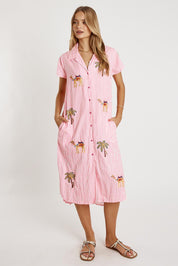 A model wearing the Sahara Cotton Shirtmaker Dress in colour Candy (Pink), from the front, showing the whole outfit