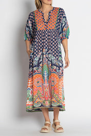 A model wearing the Sarah Midi Dress in colour Navy (Blue), from the front, cropped image