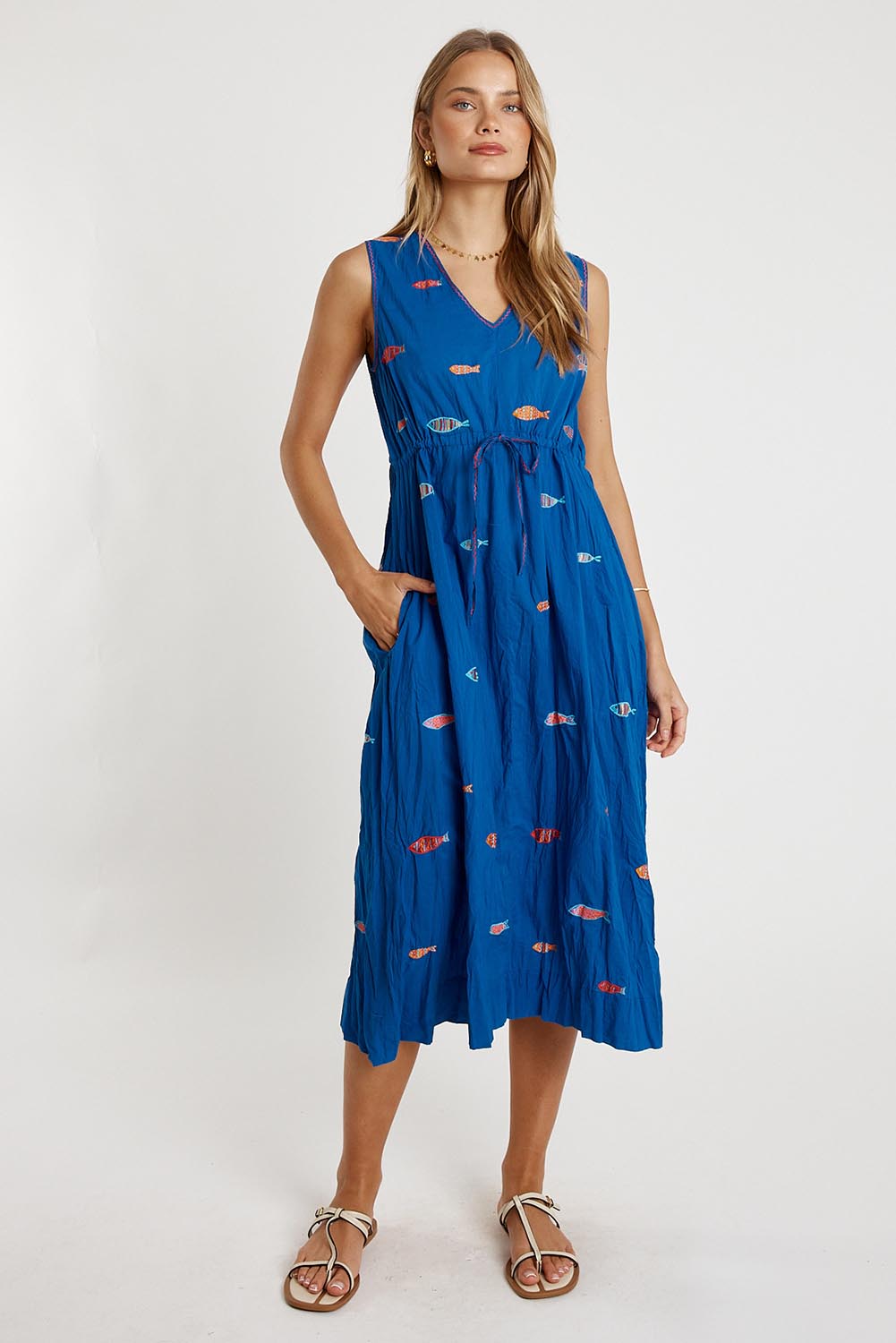 A model wearing the Sardine Tie Cotton Midi Dress in colour Ocean (Blue), from the front, showing the whole outfit