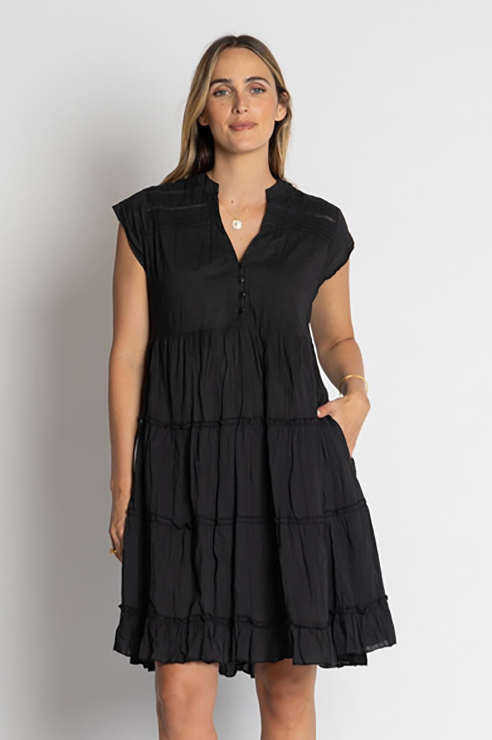 A model wearing the Shayna Cotton Tiered Dress in colour Black (Black), from the front, cropped image