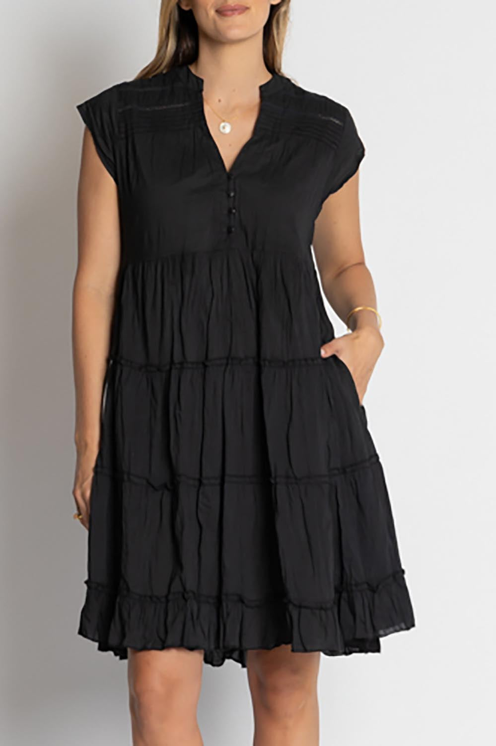 A model wearing the Shayna Cotton Tiered Dress in colour Black (Black), from the front, cropped image