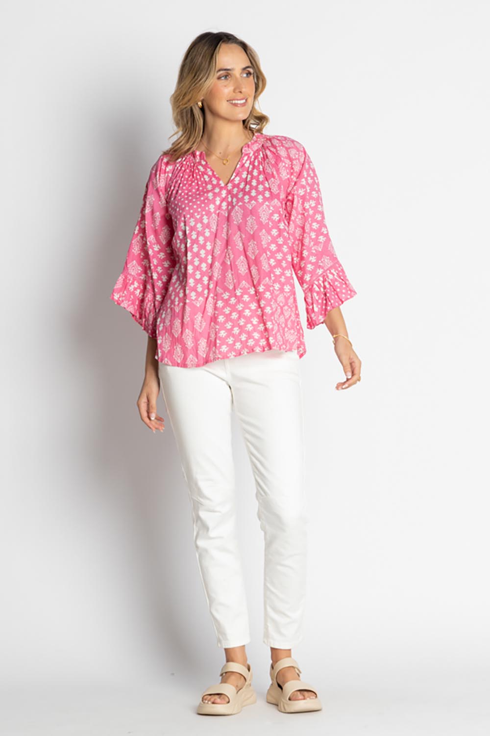 A model wearing the Talei Cotton Top in colour Musk (Pink), from the front, showing the whole outfit