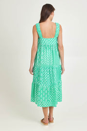 Model Madeline wearing size S of the Talei Cotton Sundress in colour Sea (Green), from the back