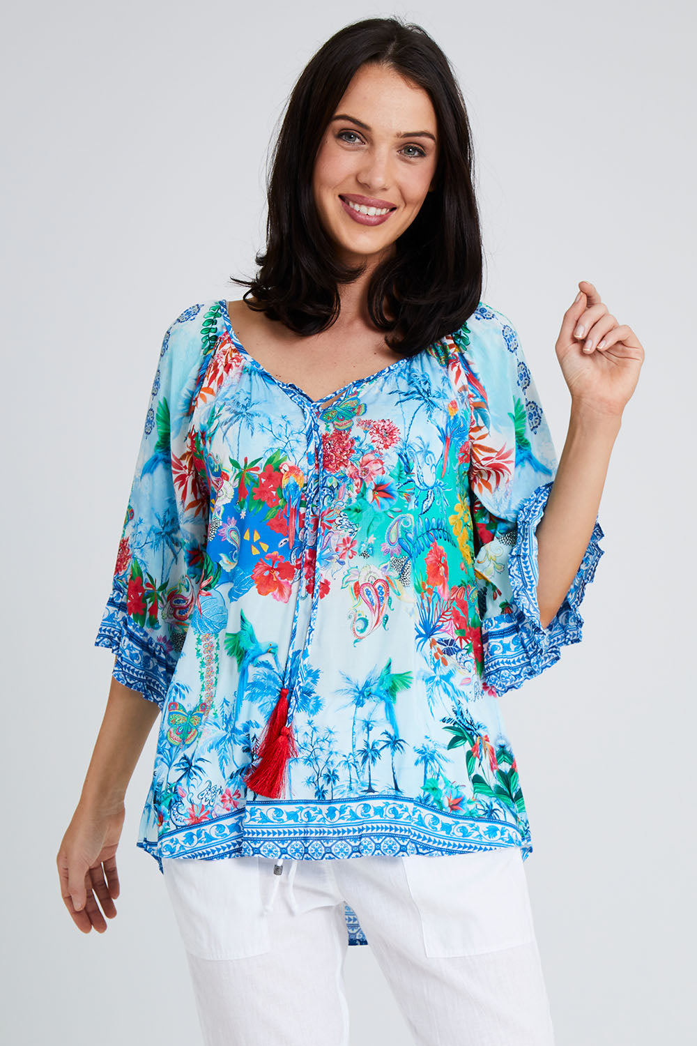 Model Andrea wearing size S of the Tara Top in colour Sky (Blue), from the front, cropped image