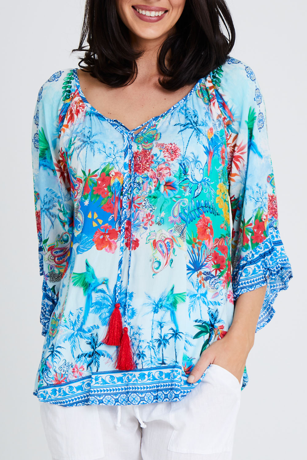 Model Andrea wearing size S of the Tara Top in colour Sky (Blue), from the front, cropped image