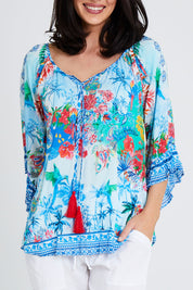 Model Andrea wearing size S of the Tara Top in colour Sky (Blue), from the front, cropped image