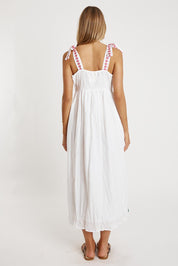 A model wearing the Tropicana Cotton Sundress in colour White (White), from the back