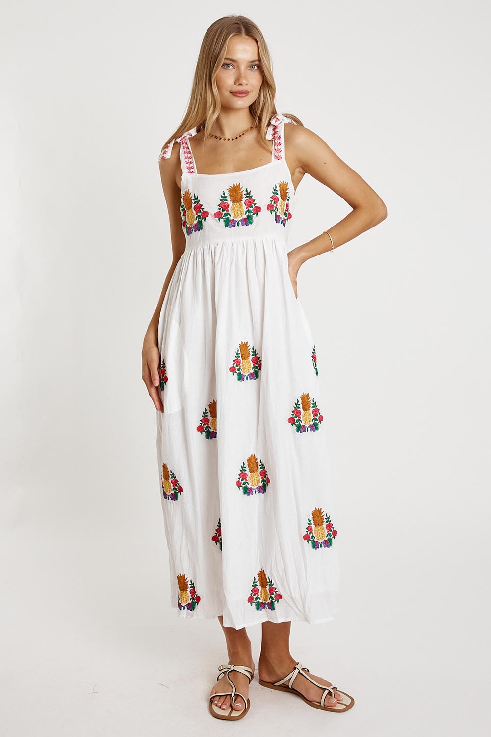 A model wearing the Tropicana Cotton Sundress in colour White (White), from the front, showing the whole outfit