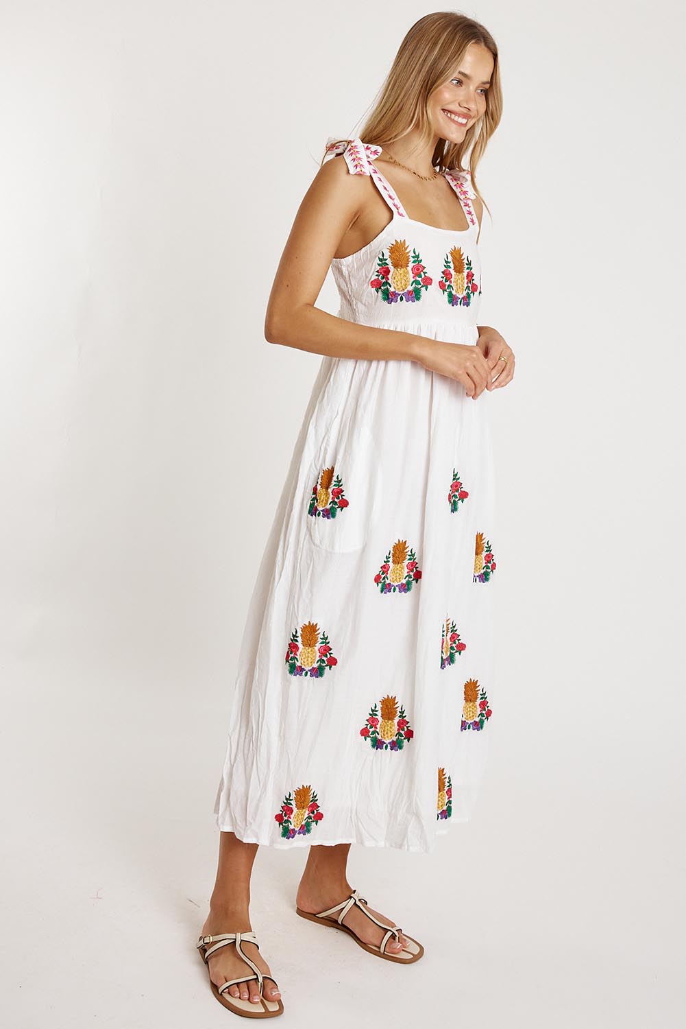 A model wearing the Tropicana Cotton Sundress in colour White (White), from the front, showing the whole outfit