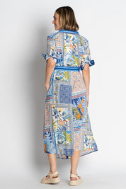 A model wearing the Velora Midi Dress in colour Ocean (Blue), from the back