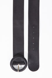 A model wearing size S of the Skye Wide Leather Waist Belt in colour Black (Black), from the front, showing the whole outfit