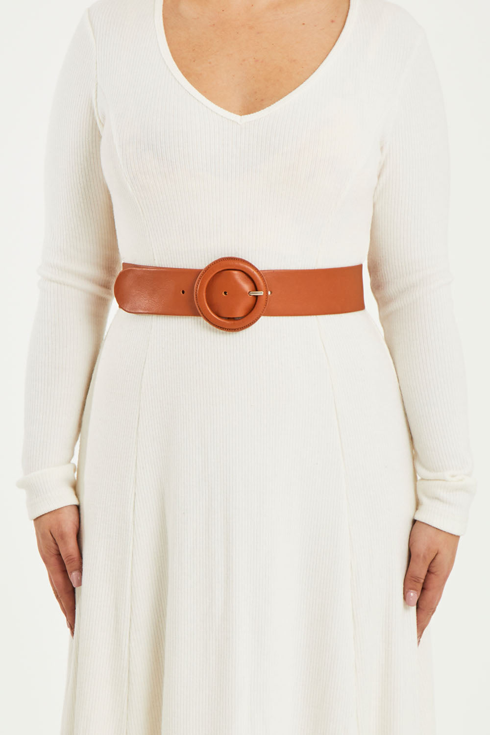 A model wearing size S of the Skye Wide Leather Waist Belt in colour Tan, from the front, cropped image