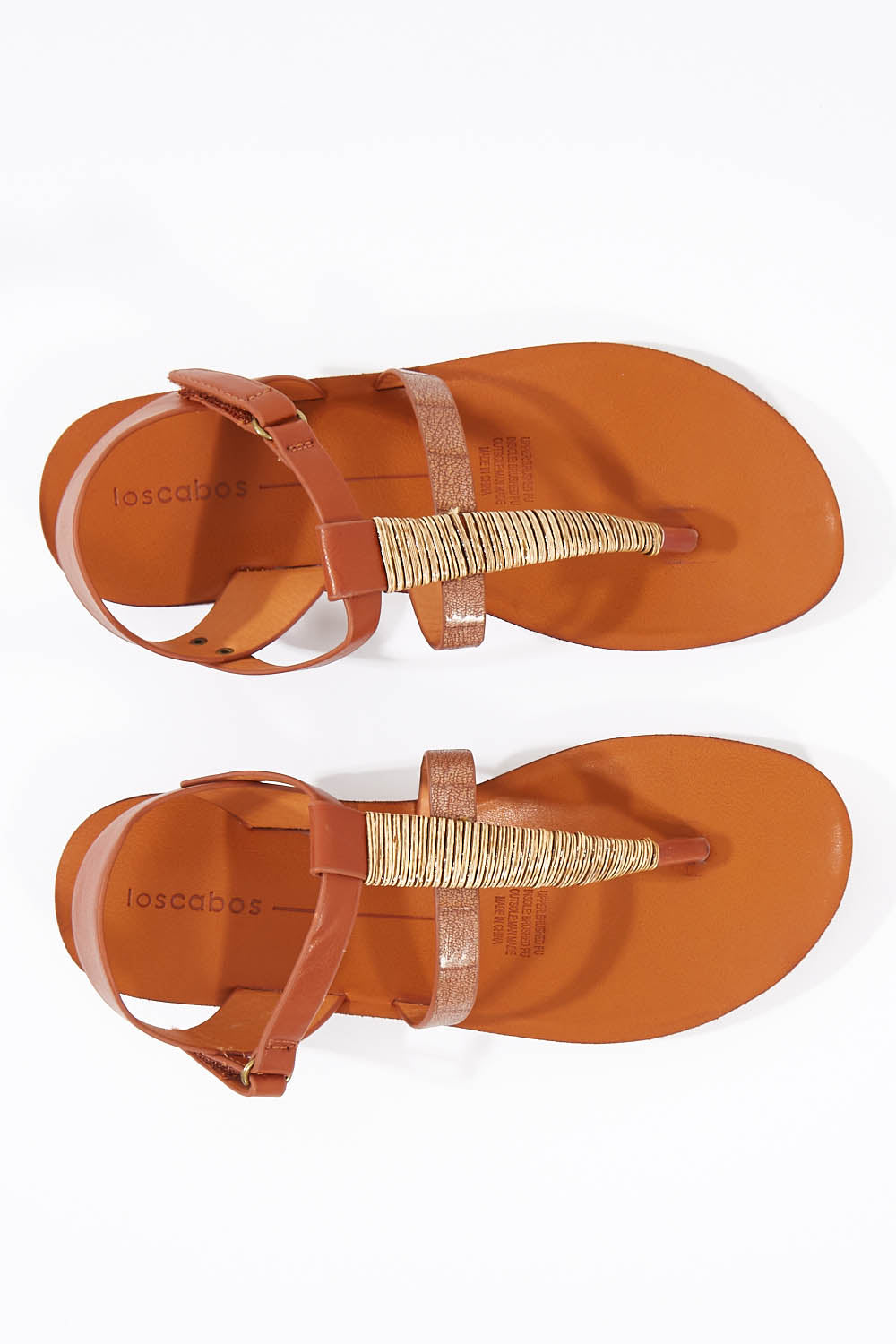 A model wearing size 37 of the Betsy Flat Sandal in colour Brandy, from the front, showing the whole outfit