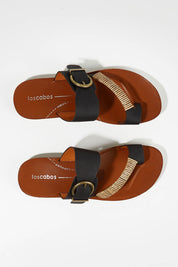 A model wearing size 37 of the Bria Flat Sandal in colour Black (Black), from the front, showing the whole outfit