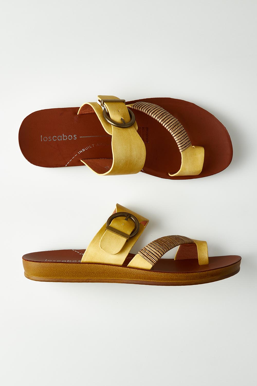 A model wearing size 37 of the Bria Flat Sandal in colour Sunset, from the front, showing the whole outfit