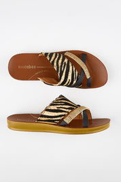 Model Genericm wearing size sample of the Bride Slide - Zebra in colour Zebra, from an angle