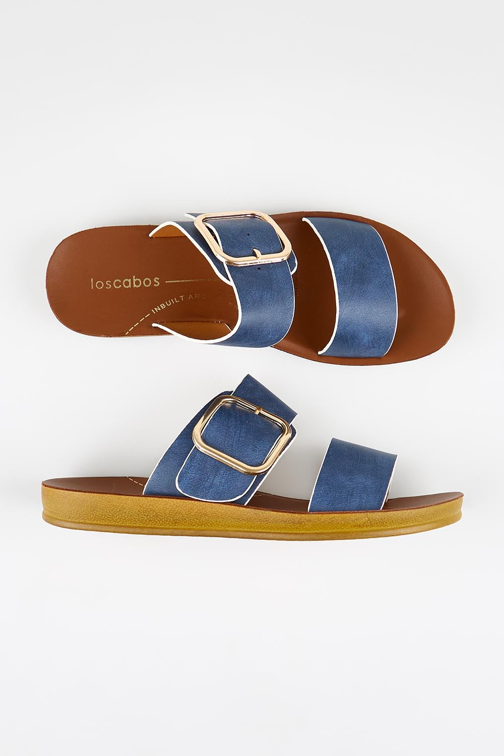 Model Genericm wearing size sample of the Doti Double Strap Slide - Navywhite in colour Navywhite, in a cropped view