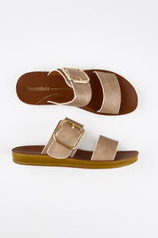 Model Genericm wearing size sample of the Doti Double Strap Slide - Taupewhiteedge in colour Taupewhiteedge, from an angle