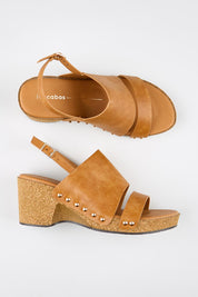 Model Genericm wearing size sample of the Maribel Heel - Brandy in colour Brandy, from an angle