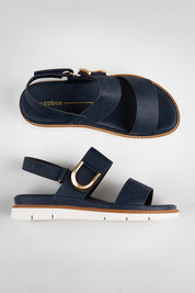 Model Genericm wearing size sample of the Sana Buckle Sandal - Navy in colour Navy, from the front