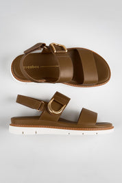 Model Genericm wearing size sample of the Sana Buckle Sandal - Nicciola in colour Nicciola, from an angle
