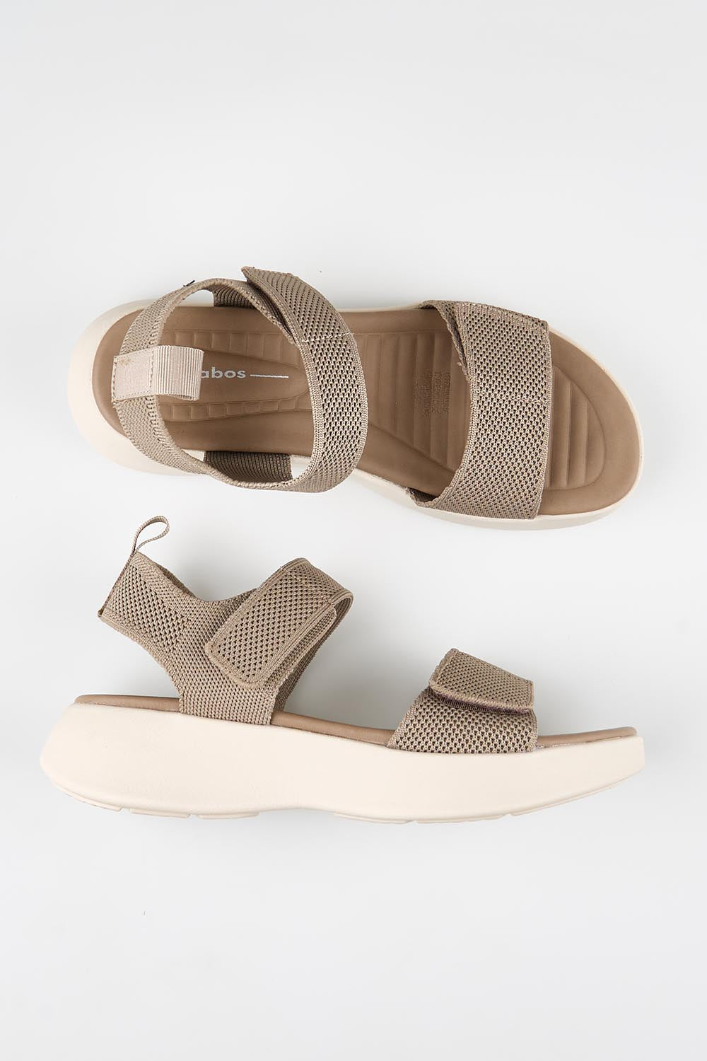 Model Genericm wearing size sample of the Shebe Velcro Sandal - Mushroom in colour Mushroom, from an angle